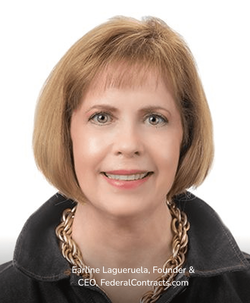 Professional headshot of a woman with short light brown hair, smiling against a white background.